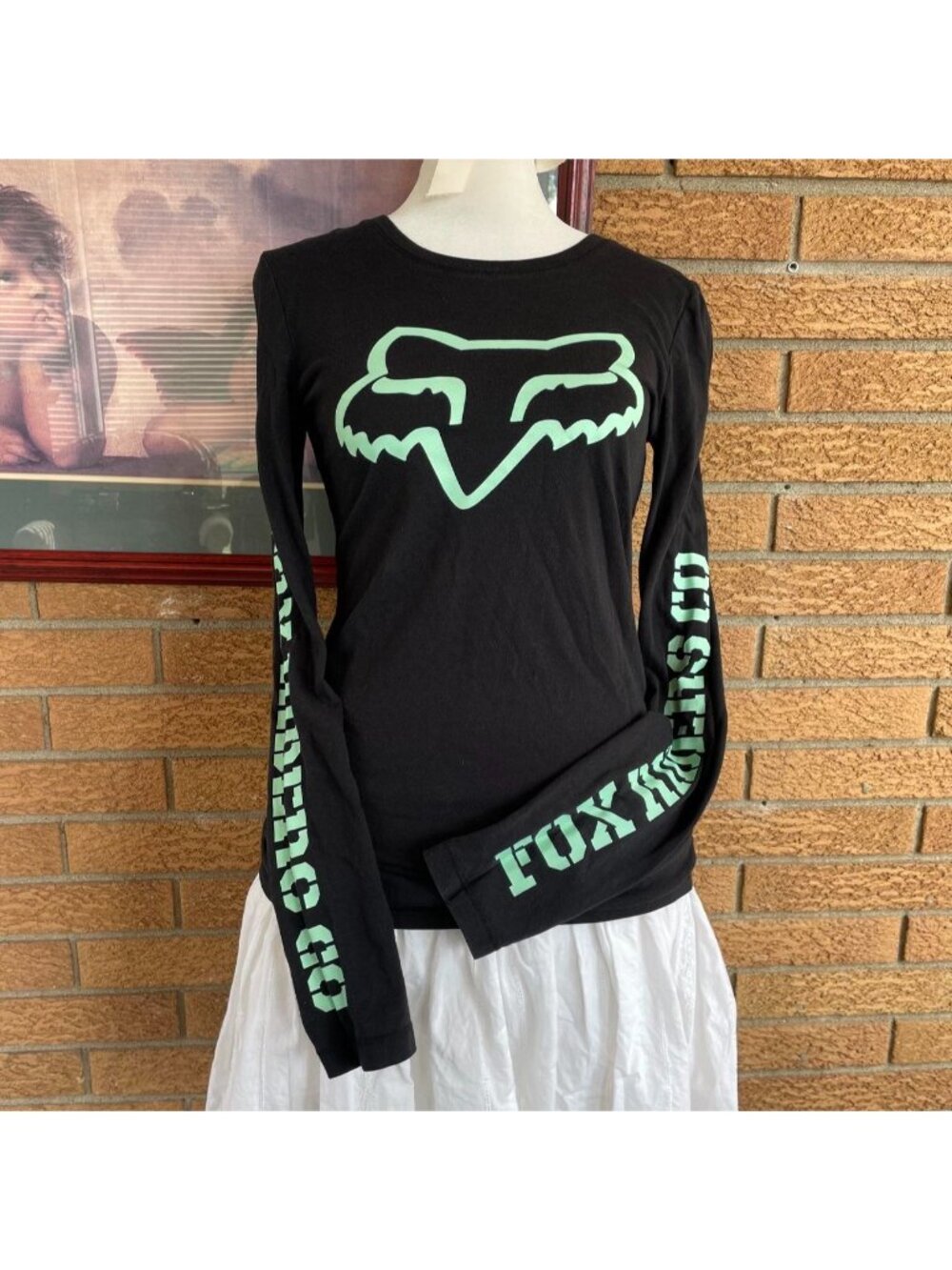 Fox Racing black long sleeve shirt with green graphics on chest and sleeves